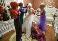 Dressing up of a Chechen bride, Grozny. The Chechens are a very proud Muslim people and stick to their cultural traditions.