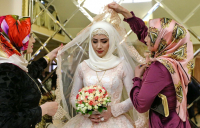 Russian Muslim bride in traditional costume. Muslims are very much part of Russian society and enjoy an honoured place without any discrimination.