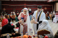 Palestinian bride and groom serve their guests. Palestinians are a very hospitable people.