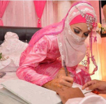 Arab bride signs on the dotted line. Islam like Christianity makes the bride’s consent mandatory for a valid marriage.